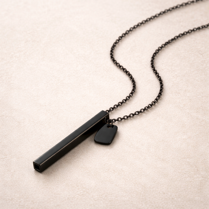 beprana black breathing necklace with vertical bar pendant on neutral background
