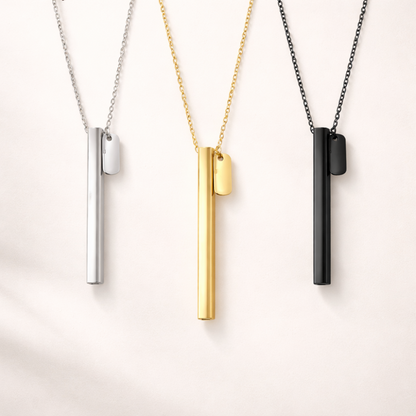 beprana breathing necklace in silver, gold and black finishes on neutral background